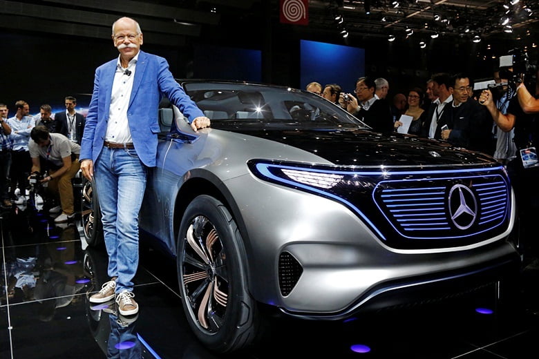 Dieter Zetsche, CEO of Daimler and Head of Mercedes-Benz, poses in front of a Mercedes EQ Electric car on media day at the Mondial de l'Automobile, the Paris auto show, in Paris, France, September 29, 2016. REUTERS/Jacky Naegelen